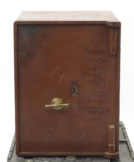 Brown cast iron safe with brass handle and key, 63.5cm