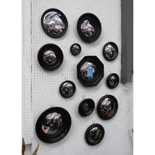 CONVEX WALL MIRRORS, a collection of twelve, Regency style d...