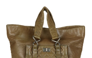 Chanel, a Reissue lambskin leather tote, crafted from khaki ...