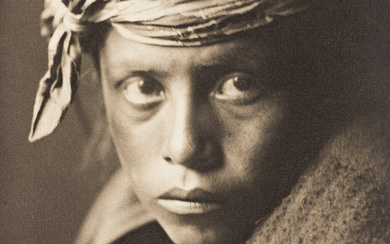 EDWARD S. CURTIS (1868-1952) A Young Navajo. Silver print, the image measuring 8x5¾...
