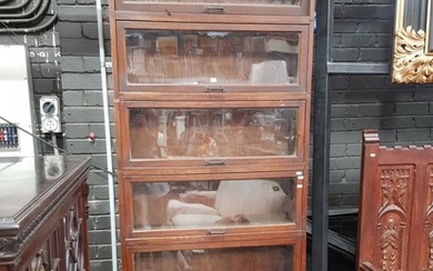 Early 20th Century Australian Oak Stacking Legal Bookcase by Butterworth, of six sections with one larger, all with glass panel door...