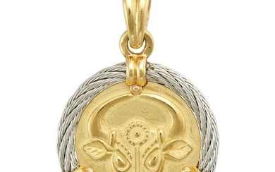 FRED PARIS, A TAURUS ZODIAC PENDANT in 18ct yellow and white gold, designed as a medallion with a