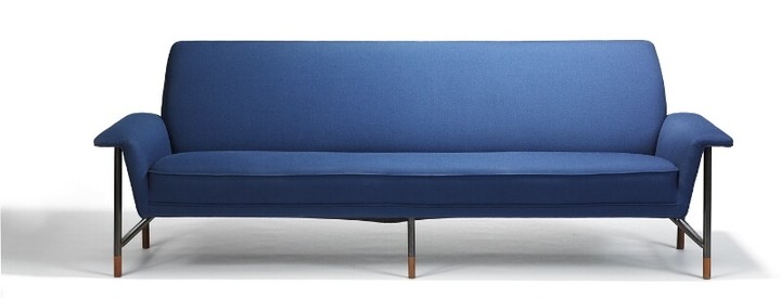 Finn Juhl: “FJ 56”. Freestanding four seater sofa with anodized metal frame with teak “shoes”. Upholstered with blue wool.