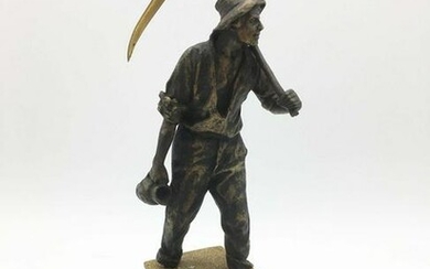 France Bronze A peasant going mowing a work of