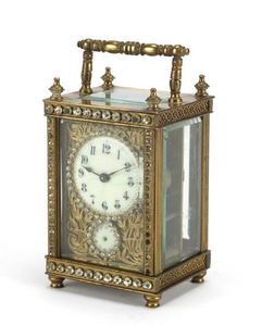 French brass cased jewelled carriage clock, with blind fret ...