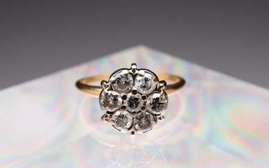 GOLD AND DIAMOND FLOWER FORM RING.