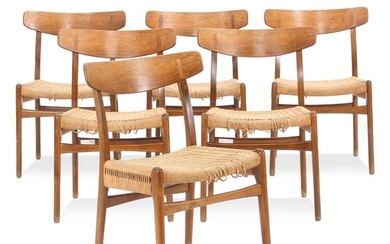 Hans J. Wegner: “CH 23”. Set of six chairs with stained beech frame, rare version with Brazilian rosewood back. Seats with woven paper cord. (6)