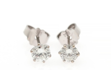 Hartmann's: A pair of diamond ear studs each set with a brilliant-cut diamond weighing a total of app. 0.76 ct., mounted in 14k white gold. TW/VS. (2)