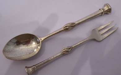 Omar Ramsden, a heavy hallmarked silver spoon with a...
