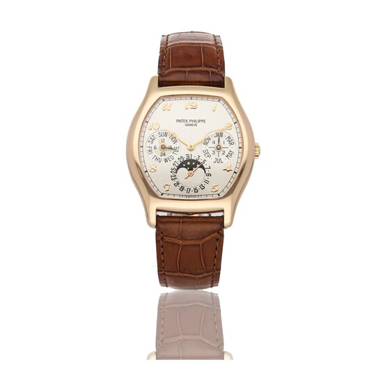 PATEK PHILIPPE | REF 5040R, A ROSE GOLD TONNEAU-SHAPED AUTOMATIC PERPETUAL CALENDAR WRISTWATCH WITH MOON PHASES CIRCA 2000
