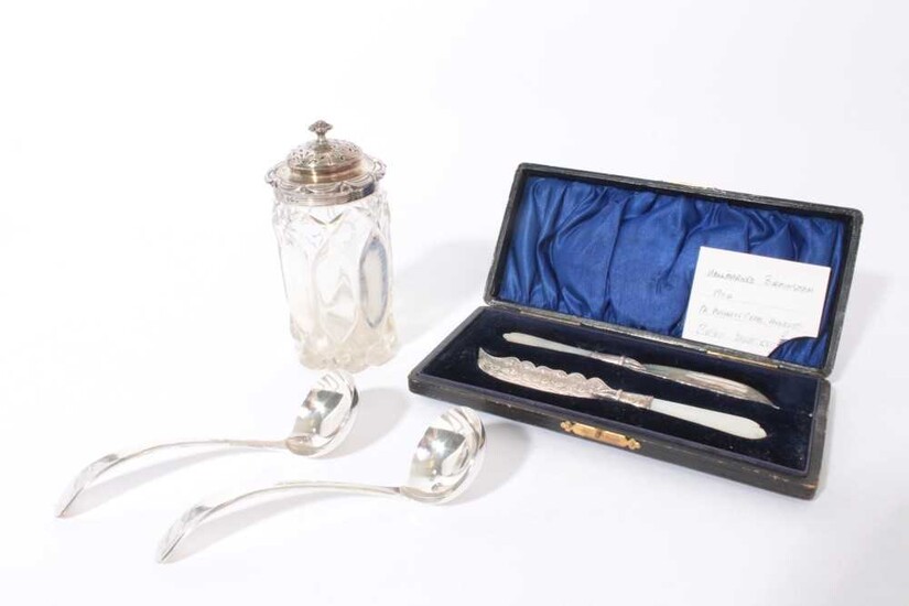 Pair of Edwardian silver butter knives with engraved decoration and mother of pearl handles, in velvet lined fitted case, (Birmingham 1904), maker Adie & Lovekin Ltd together with a pair of silver...