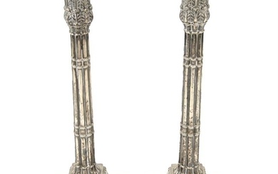 Pair of early George III silver candlesticks (filled).