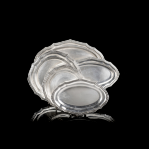 Part of a silver set composed of three oval silver tray and two silver stand (g 4500 ca.)