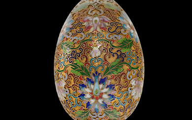 Russian gilded and enamel Easter egg on a silver stand,...