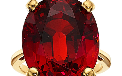 Spessartine Garnet, Gold Ring The ring centers an oval-shaped...