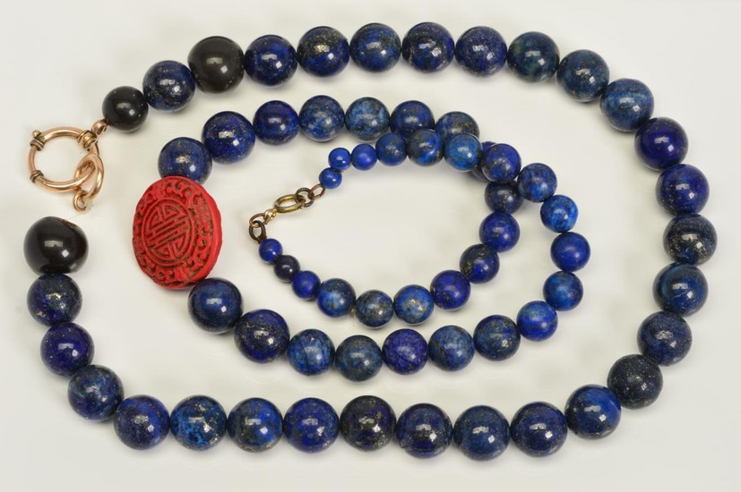 TWO SINGLE ROW LAPIS LAZULI BEAD NECKLACES, the first design...