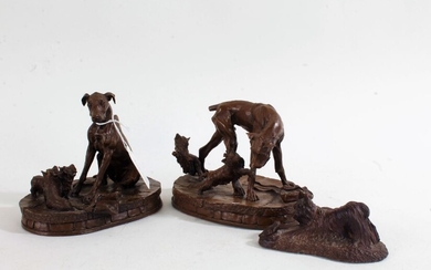 Three various bronzed dog ornaments, the two larger indistinctly signed to base and dated 1974