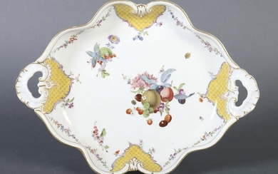Tray Meissen, probably middle of the 19th century, porcelain, glazed and decorated with flowers and fruits and garlands of flowers, four yellow cartouches underneath the rim, the cartouches framed by volutes, decorated with gold, of oval, curved form...