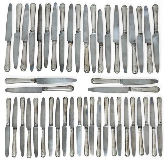 Twenty-four silver-handled Hanoverian pattern table knives, London, 1927, J. Parkes & Co., together with 23 matching dessert knives, handles same date and maker, all knives engraved with initial 'M' to terminals (a lot)