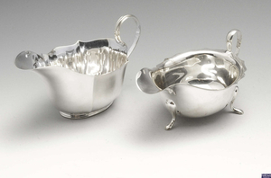 Two 1930's silver sauce boats & a 1940's small silver dish. (3).