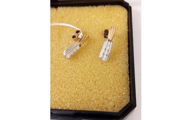 Unmarked but believed gold pair of earrings with 4 graduated...