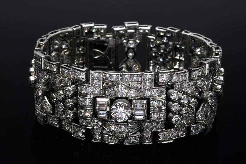 Wide Art Deco platinum bracelet with diamonds (total approx. 24.25ct/SI-P2/W-CR (H-L)) in brilliant and baguette cut, 60.5g, 17.5x2.3cm, white gold 585 safety chain