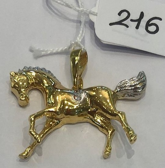 Yellow gold "horse" pendant, set with 2 zirconium...
