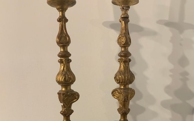 pair of carved wooden Baroque candlesticks