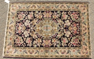 A FINE PERSIAN QUM SILK RUG, the centre with a pattern
