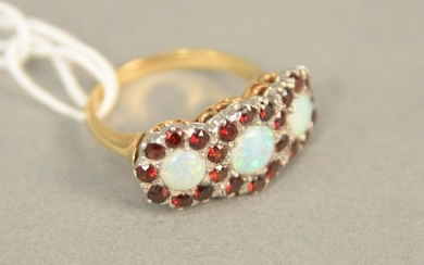 14K gold ring set with three opals each surrounded by