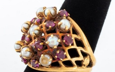 14K yellow gold ring, polished and decorated with 12 prong set round brilliant cut rubies weighing a
