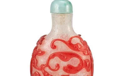 CHINESE OVERLAY GLASS SNUFF BOTTLE In spade shape, with red dragon and vine design on an opalescent ground. Height 2.3". Jadeite sto...