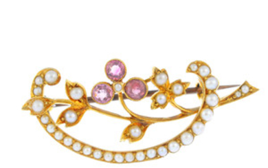 An early 20th century 15ct gold, pink sapphire and split pearl floral brooch