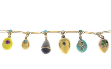An early 20th century gold egg charm bracelet.