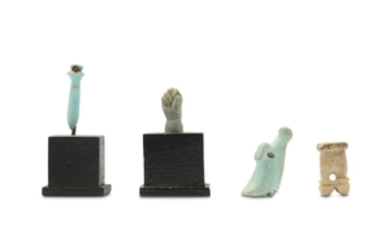 FOUR EGYPTIAN GLAZED COMPOSITION AMULETS Including a white...