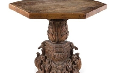 * An Italian Baroque Carved Walnut Center Table
