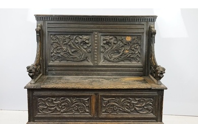 19th Century carved ebonised oak hall bench / settle having ...