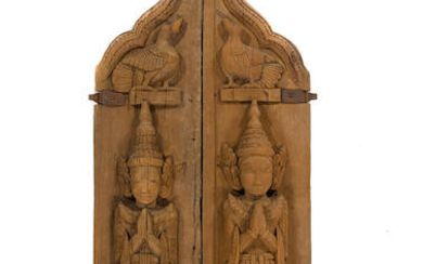 A pair of wood doors with devatas