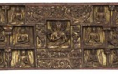 A CARVED AND POLYCHROME WOOD BOOK COVER Tibet, Circa 12th Century