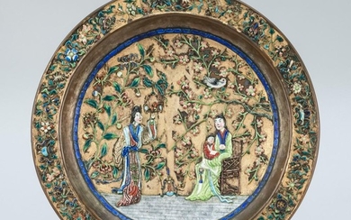 CHINESE ENAMEL-ON-COPPER PLAQUE Floral border surrounds a scene of figures in a garden. Marked "Made in China" on base. Diameter 12".