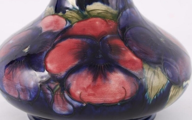 A WALTER MOORCROFT FOOTED SQUAT BULBOUS CABINET VASE