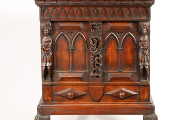 A 19TH CENTURY CARVED OAK CUPBOARD ON STAND.