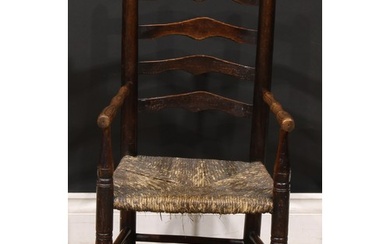 A 19th century elm child's chair, shaped ladder back, turned...