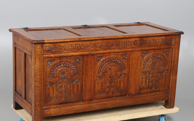 A 20TH CENTURY CARVED OAK COFFER.