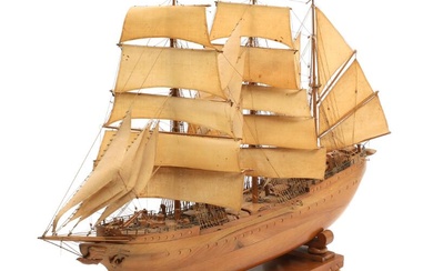 A 20th century walnut ship model in the shape of a three-masted...