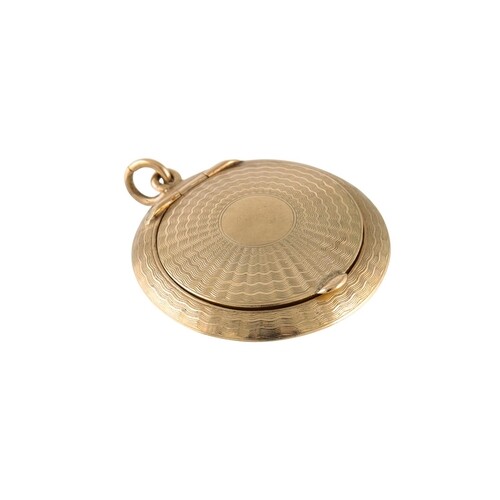 A 9CT GOLD CIRCULAR COMPACT, engine turned decoration, 14.7 ...