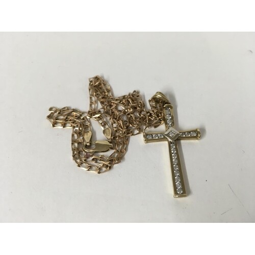 A 9ct gold and 0.50ct diamond set cross and chain. 6.5g.