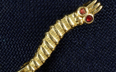 A 9ct gold red enamel 'Caterpillar Club' badge, engraved 'Sgt. W. H. T. Farmer'.