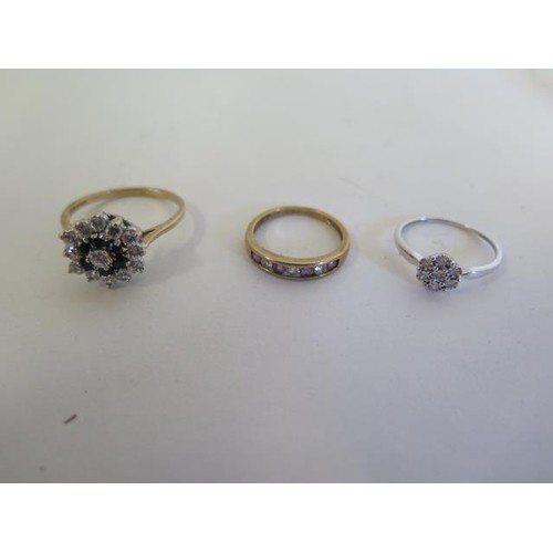 A 9ct white gold diamond cluster ring and two 9ct dress ring...