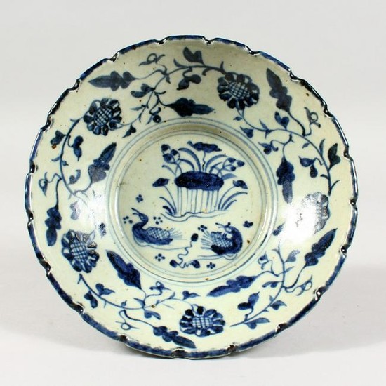 A BLUE AND WHITE POTTERY BOWL, painted with ducks and
